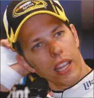  ?? James Crisp/AP ?? Brad Keselowski scratches his head with his bandaged hand at the news conference after the NASCAR Sprint Cup series auto race Saturday, June 28, 2014 at Kentucky Speedway in Sparta, Ky.