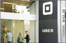  ??  ?? In this file photo, people make their way into the building that houses the
headquarte­rs of Uber in San Francisco. (AP)