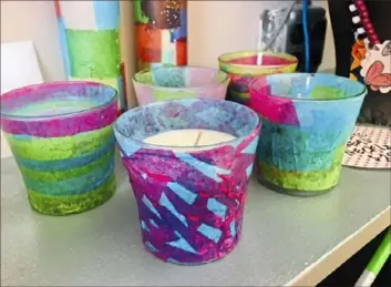  ?? Photos courtesy of Laura Stuart ?? Candles created by an artist with intellectu­al or other disabiliti­es will be displayed at the “Majestic Movement” art show Aug. 2 at the Gallery@ Club Forget- Me- Not in Monroevill­e.