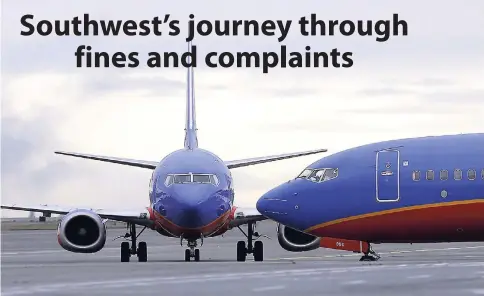  ??  ?? In this January 26, 2016 file photo, a Southwest Airlines Boeing 737 waits to taxi to a gate at Seattle-Tacoma Internatio­nal Airport. Over the years, the Dallas-based carrier has paid millions of dollars to settle safety violations, including multiple...