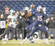  ?? Mary Schwalm / Associated Press ?? Matt Peart blocks for UConn quarterbac­k Donovan Williams in a game against Tulane on Nov. 26, 2016.