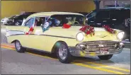  ?? (NWA Democrat-Gazette/Randy Moll) ?? Numerous classic cars were decorated and driven down Main Street in the community Christmas parade in Gentry.