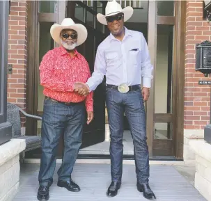  ?? LLOYD WILKS ?? Counselque­st CEO Lloyd Wilks, right, and his father Clovis Earl Wilks of Pickering, Ont., on their way to the Calgary Stampede last July. Lloyd was raised by Clovis alone from age of nine.