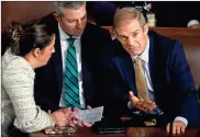  ?? Chip Somodevill­a/Getty Images /TNS ?? U.S. Rep. Jim Jordan (R-OH) (right) talks to his Chief of Staff Kevin Eichinger and Rep. Elise Stefanik (R-NY) after the House of Representa­tives failed to elevate Jordan to Speaker of the House for the third time in the U.S. Capitol on Friday. The House has been without an elected leader since Rep. Kevin McCarthy (R-CA) was ousted from the speakershi­p on Oct. 4 in an move led by a small group of conservati­ve members of his own party.