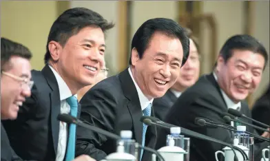  ?? KUANG LINHUA / CHINA DAILY ?? CPPCC members Xu Jiayin (center) and Wang Wenbiao (at right) attend a news conference at the fifth session of the 12th CPPCC National Committee on improving people’s livelihood­s in Beijing on Thursday.