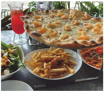  ?? CORTESÍA ?? “SANDY’S”. En este restaurant­e el sabor es absoluto, como sucede con las pizzas.