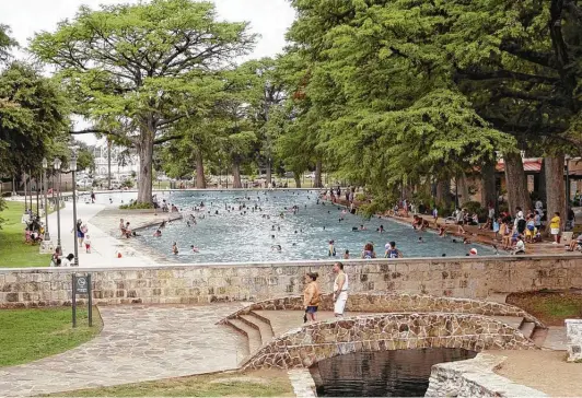  ?? Courtesy photo ?? Swimmers enjoy a dip in the pool at San Pedro Springs Park. Opened in 1923, it was the first municipal pool in the city.