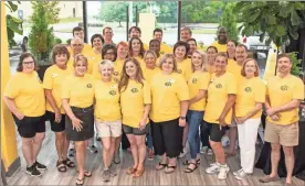  ?? Tim Godbee ?? GCB employees gathered to greet members of the public as well as community partners for the Calhoun branch grand reopening Saturday.