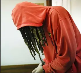  ?? The Associated Press ?? Alexander Zemlianich­enko
WNBA star Brittney Griner leaves a courtroom after a hearing in Khimki just outside Moscow Friday. Griner has been detained in Russia on drug possession charges since February.