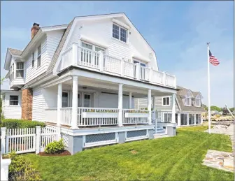  ?? Contribute­d photos ?? Crisp whites and shades of blue define this early 20th-century waterfront beach house, part of the Madison Historical Society’s sixth annual Tour of Remarkable Homes on Sunday.