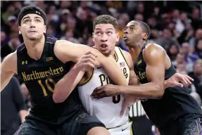  ?? ?? Purdue forward Mason Gillis, center, battles for a rebound against Northweste­rn forward Tydus Verhoeven, left, and guard Chase Audige Sunday during an NCAA college basketball game in Evanston, Ill. (AP photo/Nam Y. Huh)
