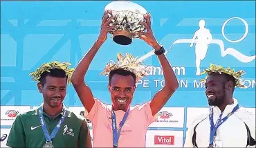  ?? Picture: PHANDO JIKELO/ANA PICTURES ?? VICTORY IS SWEET: In the men’s race Ketema Negasa (left) from Ethiopia finished second with a time of 2:11.06, the first place winner Asefa Mengstu Negewo (centre) also from Etheopia had a time of 2:10.01 and Duncan Maiyo from Kenya was placed third...