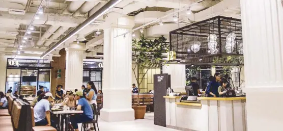  ??  ?? Not your regular food court: The Grid Food Market is located on the second floor of Power Plant Mall's new wing.