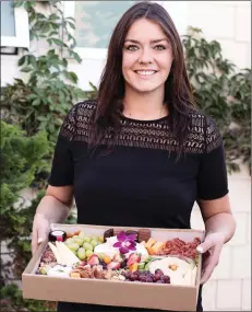  ?? Photo contribute­d ?? Sheena Barbour, operating partner of the Graze Company Okanagan, shows off a Graze box. The Graze Company Okanagan opened on the Westside last October.