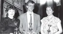  ?? ?? Bartlemy Macra members with their trophies, Mary Barry (make and model), John Murphy (gardening) and Marie Hazelwood (make and model) at the 1987 Imokilly Macra dinner in Ashbourne House Hotel. (The Avondhu Archives)