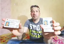  ?? Reuters ?? Hani Al-Bazoni shows his ID during an interview in Basra.