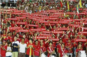  ??  ?? In full force: Myanmar fans filled the Thuwanna Stadium in Yangon to the brim during the AFF Suzuki Cup against Malaysia on Saturday. Myanmar won 1-0. —EPA