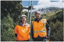  ?? ?? DOC Taranaki Crossing project infrastruc­ture lead Wayne Boness and Abseil Access site manager Matthew Thom have both been working on the new Manganui bridge.