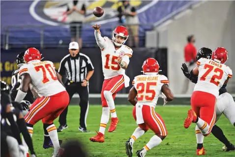  ?? NICK WASS/ASSOCIATED PRESS ?? Kansas City Chiefs quarterbac­k Patrick Mahomes jumps to pass during the first half of Monday’s game against the Ravens in Baltimore. The Chiefs won 34-20. Mahomes and Kansas City shredded a normally stalwart Baltimore defense.