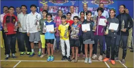  ??  ?? Champions in the various age categories of Manora Badminton Academy pose with their certificat­es and trophies along with chief guests during Junior Badminton Tournament