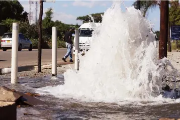  ?? ?? Treated water gushes from a broken pipe along Highfield Road in Harare for the second day yesterday, with the Harare City Council yet to attend to the fault.— Picture: Nicholas Bakili.