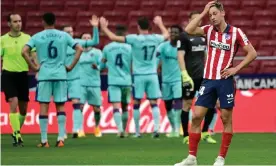  ?? Photograph: Javier Soriano/AFP/Getty Images ?? Marcos Llorente reacts as Levante complete a 2-0 win over Atlético Madrid at the Wanda Metropolit­ano.