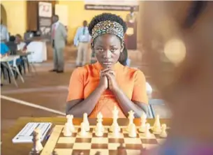  ?? Edward Echwalu Disney ?? MADINA NALWANGA portrays Phiona Mutesi in “Queen of Katwe,” the true story of a girl from rural Uganda whose world changes when she learns chess.