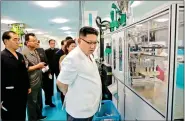  ??  ?? North Korean leader Kim Jong Un visits the newly-built Dental Sanitary Goods Factory in this undated photo.