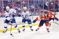  ?? LYNNE SLADKY/ASSOCIATED PRESS ?? The defending champion Tampa Bay Lightning (white jerseys) play against the Florida Panthers in a game earlier this week. The intrastate rivals will open the NHL Playoffs against each other.