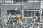  ?? PTI ?? Bulldozers during the anti-encroachme­nt drive at Shaheen Bagh in New Delhi on Monday.