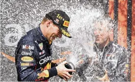  ?? PAUL CHIASSON / THE CANADIAN PRESS ?? Max Verstappen is sprayed with champagne after winning the Canadian Grand Prix in Montreal on Sunday.
