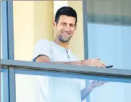  ?? REUTERS ?? Quarantine­d Djokovic at his hotel balcony in Adelaide.