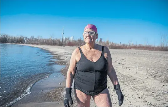  ?? NICK KOZAK PHOTOS FOR THE TORONTO STAR ?? Writer Kathleen Mcdonnell is a cold-water swimmer. She swims in Lake Ontario year-round, as long as there is open water.