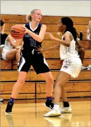  ?? PILOT PHOTO/BEV HARAMIA ?? Laville’s Faith Rock (left) looks for a teammate while CGA’S Dionna Craig applies defensive pressure during high school girls basketball action Saturday.