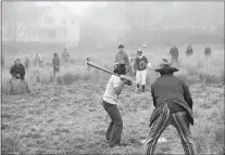  ??  ?? “Annual Easter softball game at Dodge Paddock. Bill White, shortstop; Charlie Davol, umpire; Peter Freeman, pitcher; Ann Freeman, at bat” by Rollie McKenna ( courtesy The Stonington