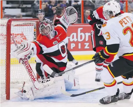  ?? PHOTO BY JEAN LEVAC/OTTAWA CITIZEN ?? 67’s goaltender Jacob Blair makes a great save on Niki Petti of the Belleville Bulls during first-period action Friday night at the Canadian Tire Centre.