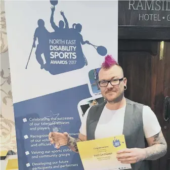  ??  ?? Sunderland Deaf AFC’s manager Scott Garthwaite with his award.