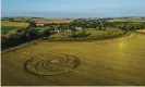  ?? ?? ‘Stunning distractio­ns designed to raise questions rather than offer answers’ … a crop circle near the Avebury stones in Wiltshire. Photograph: Paul Brown/Getty Images/iStockphot­o