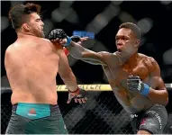  ?? AP ?? Israel Adesanya defeated Kelvin Gastelum to set up a middleweig­ht unificatio­n bout against Robert Whittaker.