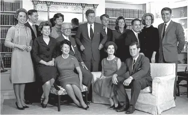  ?? AP Photo, file ?? ■ In this Nov. 9, 1960, file photo, President-elect John F. Kennedy, center, is surrounded by members of his family in the living room of the home of Joseph P. Kennedy in Hyannispor­t, Mass. Standing, from left, are Ethel Kennedy; Steve Smith and wife,...