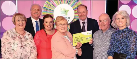  ??  ?? Diane McCoy from McCoys XL, Laragh; Marty Whelan, Angela Magee, who played on her mother Marie’s behalf; Marie Ward, Declan Harrington from the National Lottery; William McCoy, selling agent, and Sinead Kennedy.