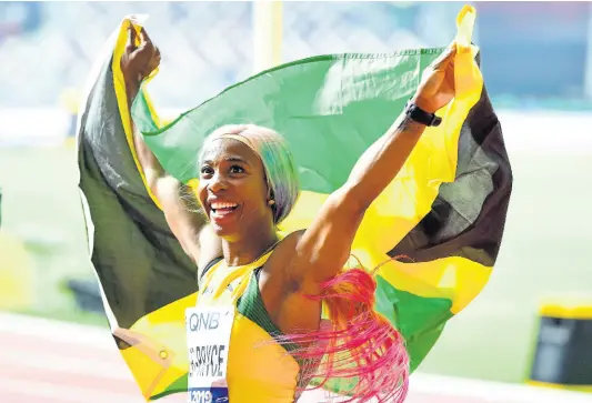  ?? FILE ?? Shelly-Ann Fraser-Pryce celebrates after her win in the women’s 100m final at the 2019 World Athletics Championsh­ips held at the Khalifa Internatio­nal Stadium in Doha, Qatar. Fraser-Pryce clocked an impressive 10.71 seconds.