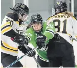  ?? RICHARD LAUTENS TORONTO STAR FILE PHOTO ?? Taylor Woods, pictured centre doing battle in a CWHL contest in 2018, is one of five players under contract with the NWHL’s newest expansion franchise in Toronto.