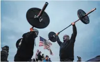  ?? LIBBY MARCH THE NEW YORK TIMES ?? People protest COVID-19 restrictio­ns outside a gym in Orchard Park, N.Y., on Monday. Western New York, a bustling five-county region of some 1.4 million people along the Canadian border, has emerged as the biggest trouble spot of the state's second wave.