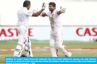  ??  ?? DURBAN: Sri Lanka’s Kusal Perera (R) celebrates the victory after hittting the winning runs with Vishawa Fernando (L) during the fourth day of the first Cricket Test between South Africa and Sri Lanka at the Kingsmead Stadium in Durban yesterday. — AFP