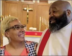  ?? (Arkansas Democrat-Gazette/Frank E. Lockwood) ?? Pastor Randall Lewis and his wife, Kim, pause following his June 19 ordination as a Minister of Word and Sacrament in the Lutheran Church — Missouri Synod before heading to a reception in his honor.