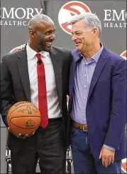  ?? CURTIS COMPTON / CCOMPTON@AJC.COM ?? Hawks coach Lloyd Pierce (left) is joined at his introducto­ry news conference in May by Hawks principal owner Tony Ressler. Pierce is promoting a faster pace of play this season.