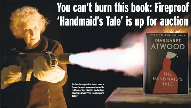  ?? ?? Author Margaret Atwood uses a flamethrow­er on an unburnable edition of her classic, and often banned, novel “The Handmaid’s Tale.”