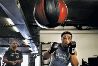  ?? Photos by Carlos Avila Gonzalez / The Chronicle ?? Karim Mayfield works out at the 3rd Street Boxing Gym with his trainer, Ben Bautista. Mayfield’s brother, Sahleem Tindle, was killed by BART police in January. The family has filed a legal claim against BART.