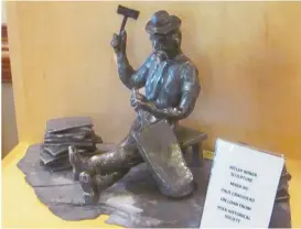  ??  ?? Sculpture of miner is in recognitio­n of the Welsh people who came to bring building material from the ground for use in the early communitie­s of Van Wert and Rockmart.